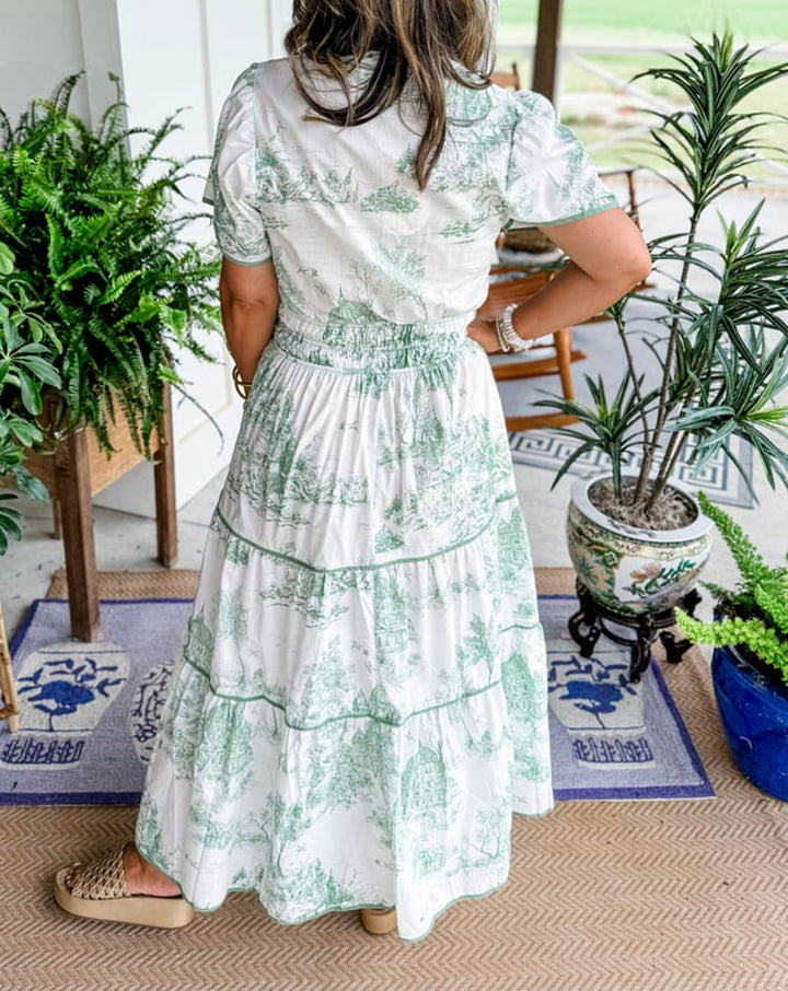 Model wearing the Camille Classic Toile Maxi Dress in black showing the v-neckline detail