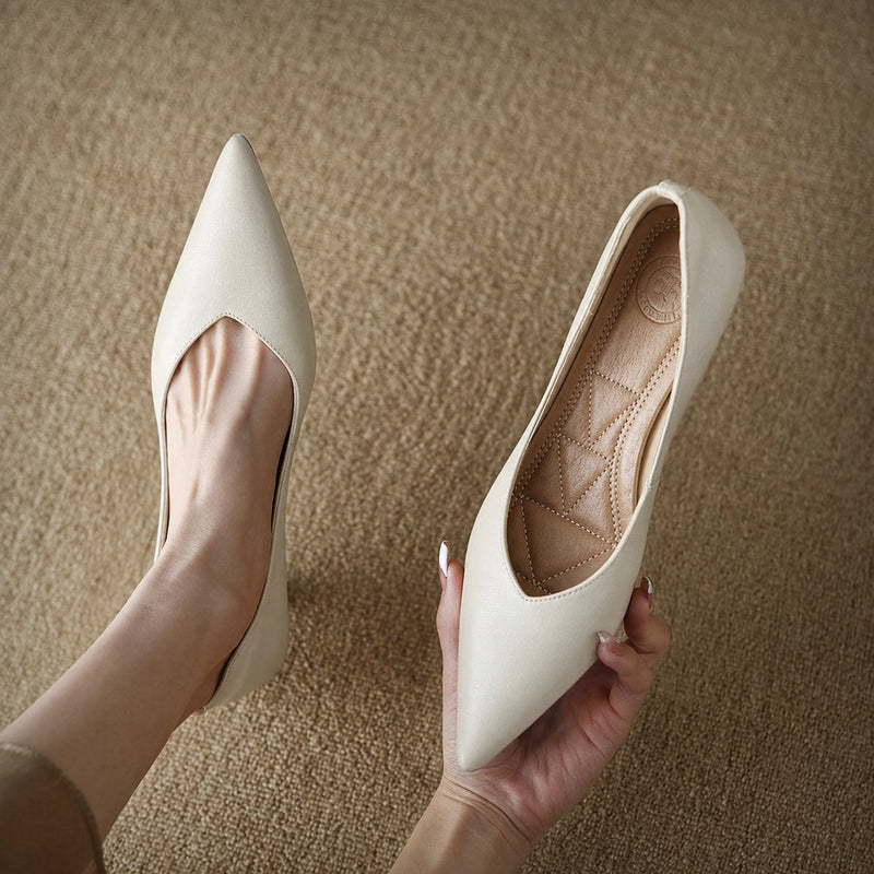 Camille beige slip-on pump, top-down view showing smooth upper and pointed toe