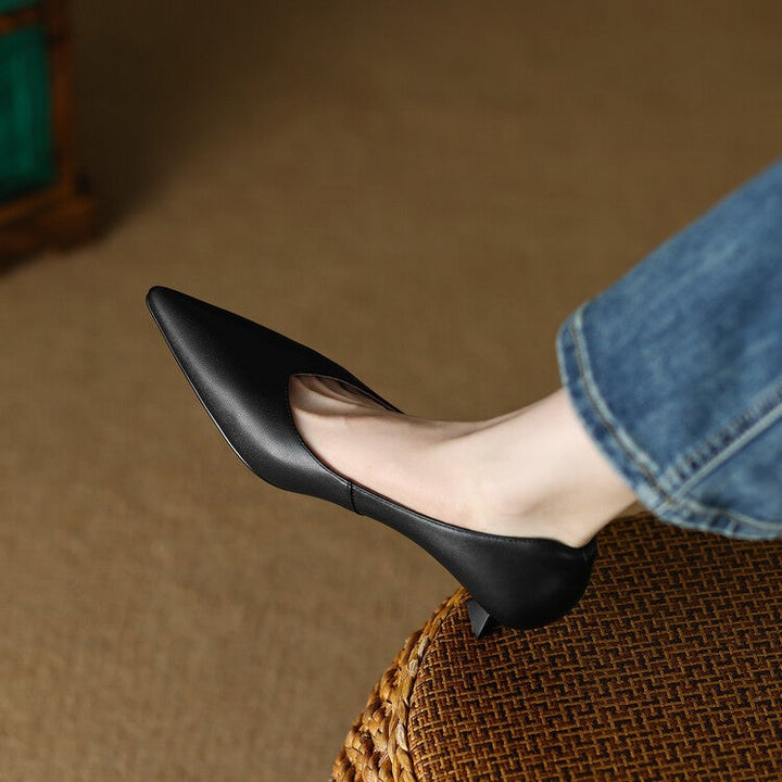Camille black pointed toe kitten heel slip-on pump, side view on white background