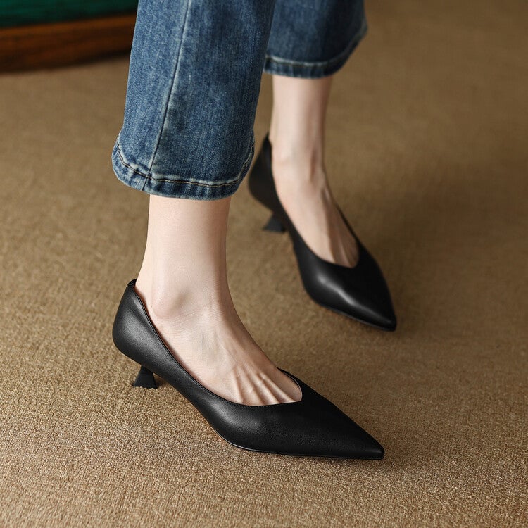 Camille black pump worn on foot, side profile showing heel height and silhouette