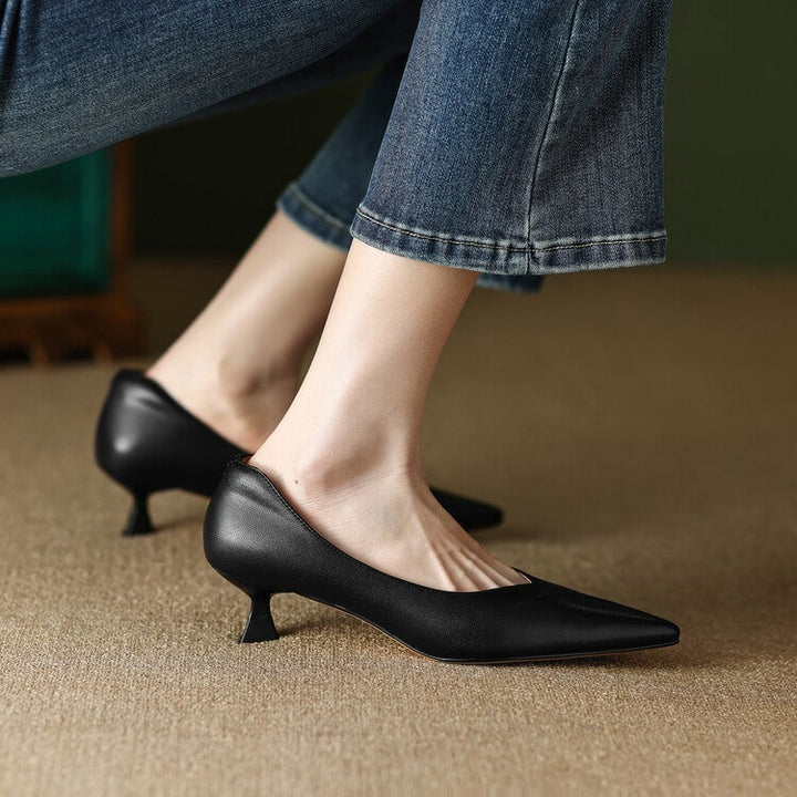 Camille beige pump styled with tailored trousers, lifestyle shot