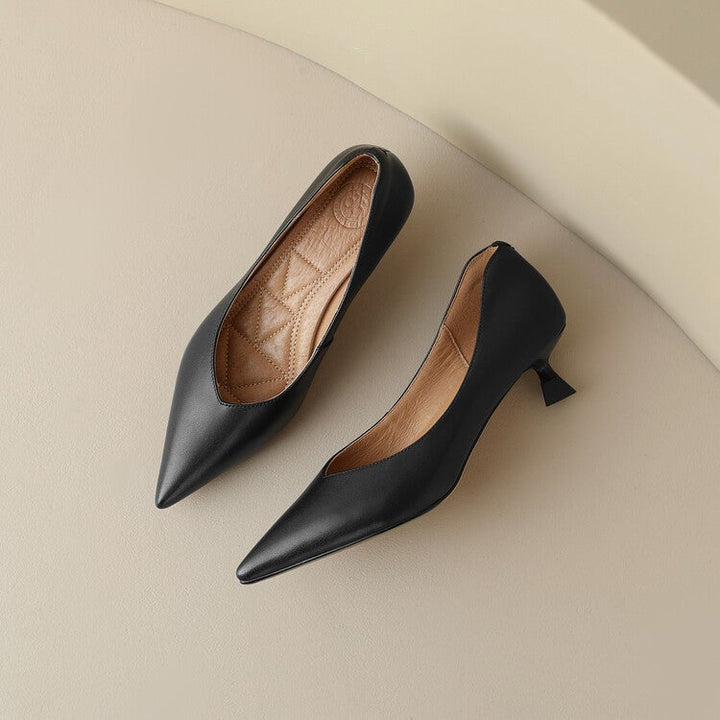 Camille black pump styled with a midi skirt, lifestyle shot