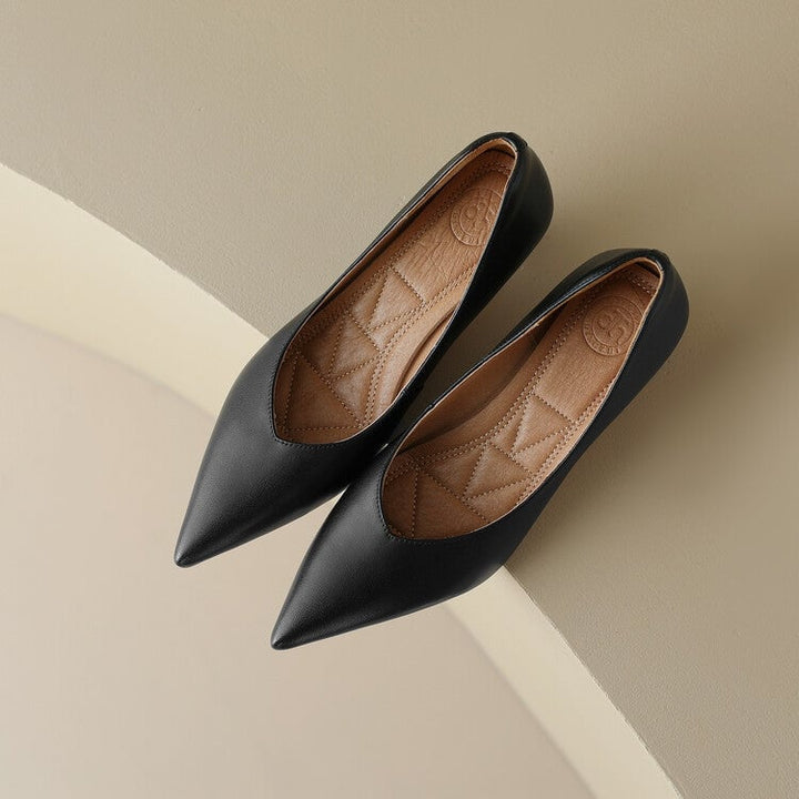 Camille kitten heel pump sole detail showing flared heel base and construction