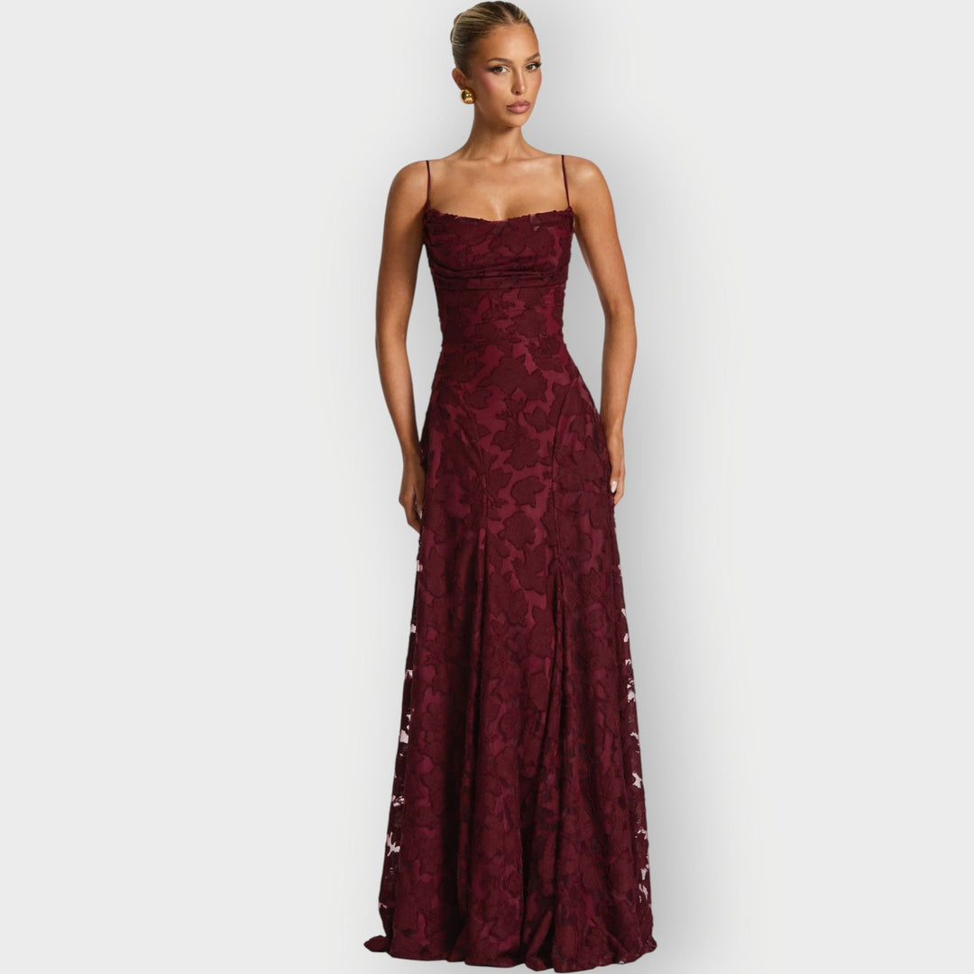 Model wearing an elegant strapless velvet gown in blush pink with a flattering structured silhouette
