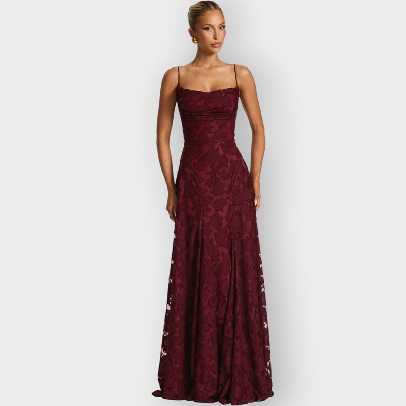 Model wearing an elegant strapless velvet gown in blush pink with a flattering structured silhouette