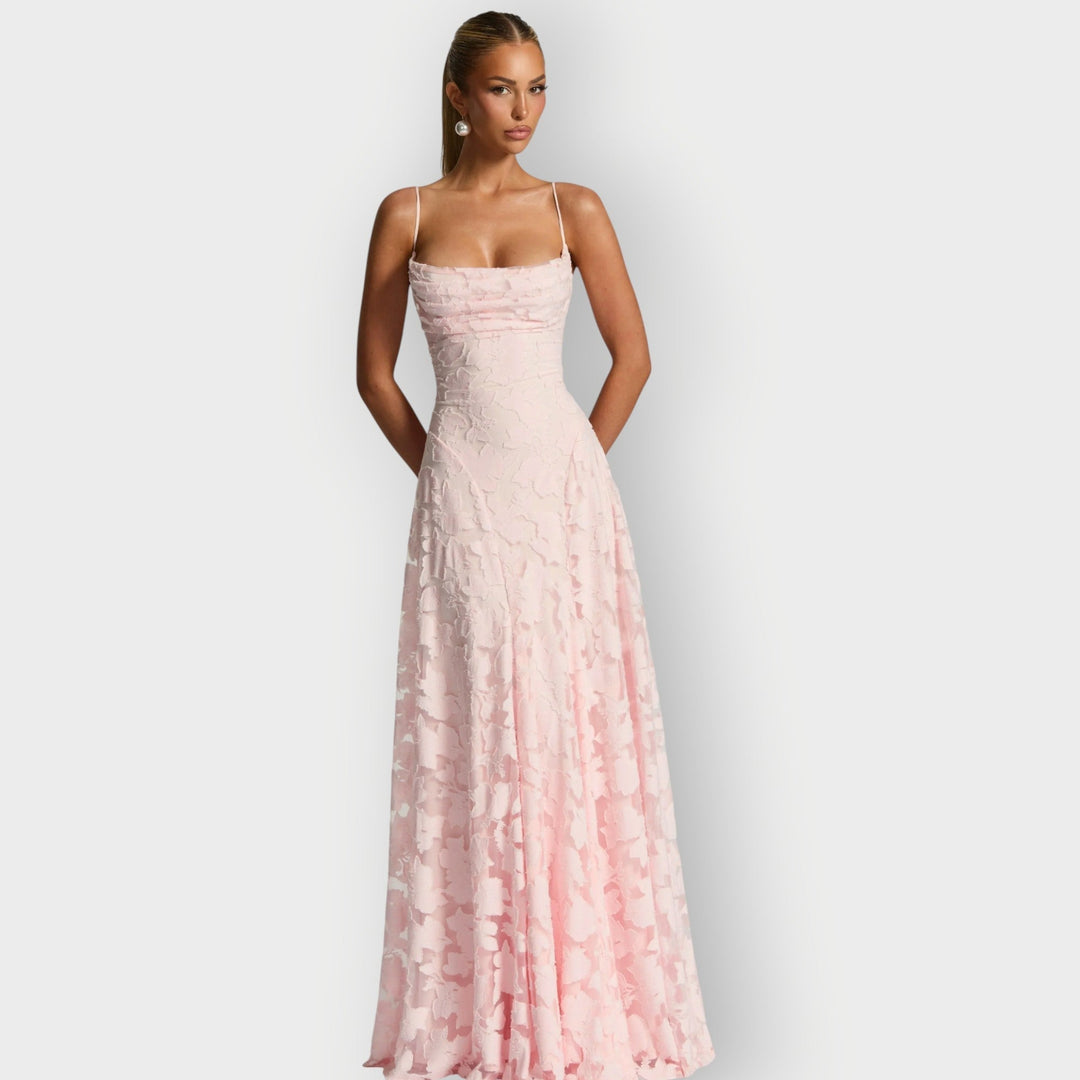 Close-up of the rich velvet fabric texture on the strapless gown in ivory