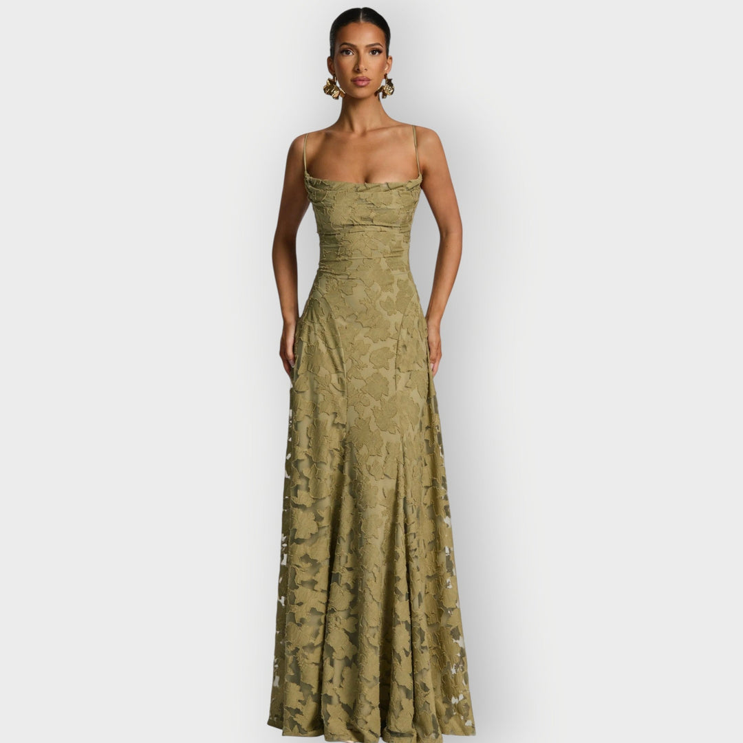 Model posing in the strapless velvet gown in pink showing the elongated silhouette and smooth finish