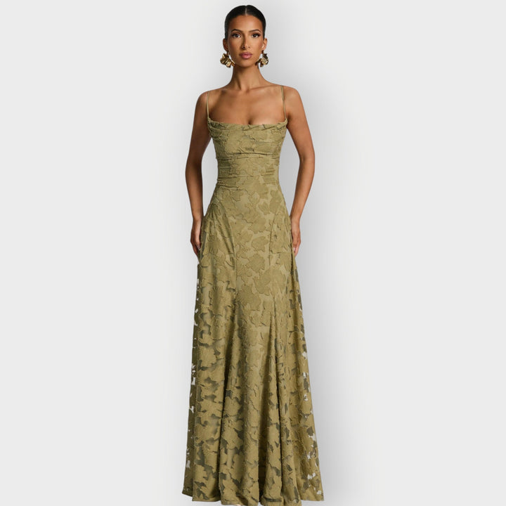 Model posing in the strapless velvet gown in pink showing the elongated silhouette and smooth finish