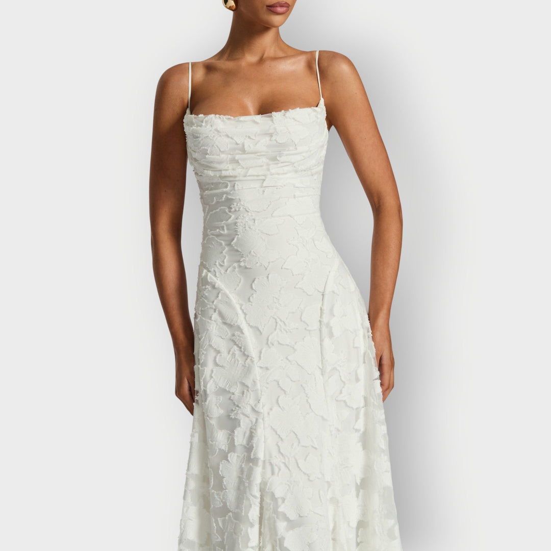 Three-quarter view of the ivory strapless velvet gown showing the flattering fit and flare