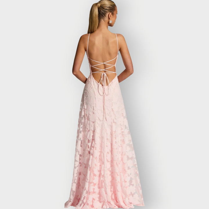 Flat lay of the strapless velvet gown in ivory showing the overall silhouette and fabric quality