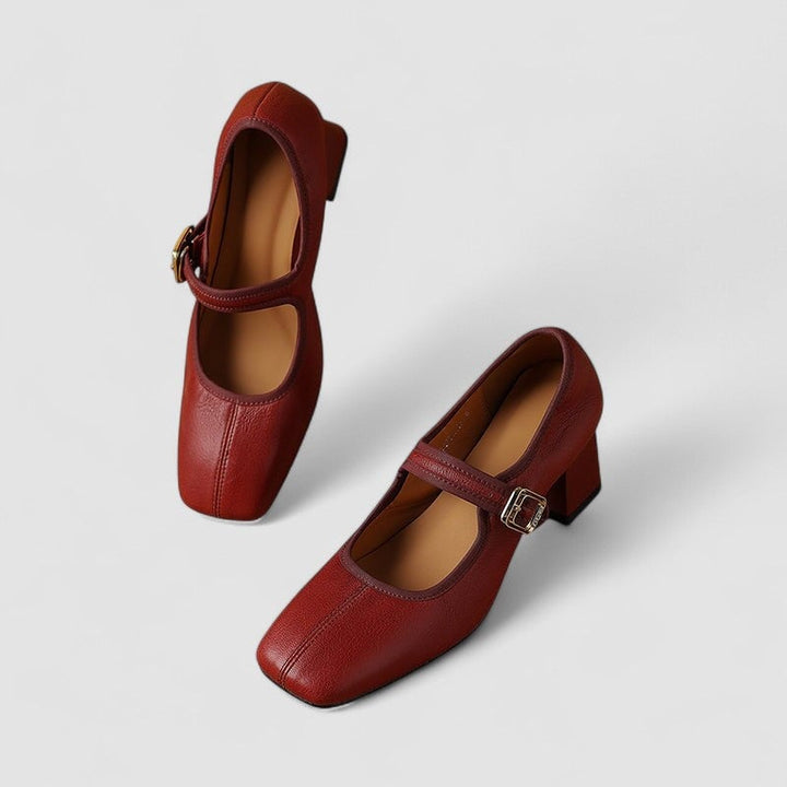 Cara Mary Jane shoes in red on a white background, top-down view