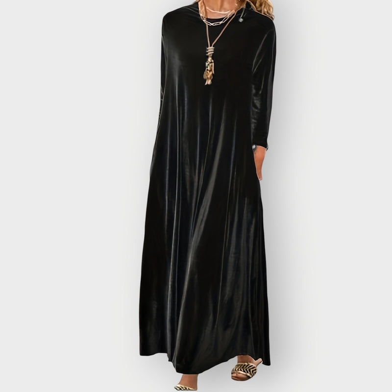 Front view of velvet maxi dress in dark green showing graceful drape and full-length silhouette