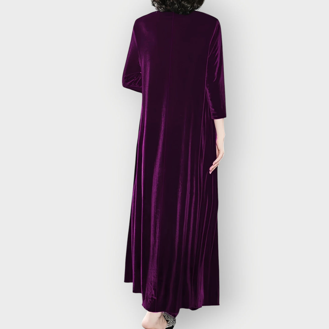 Detail shot of velvet maxi dress neckline and bodice in deep purple