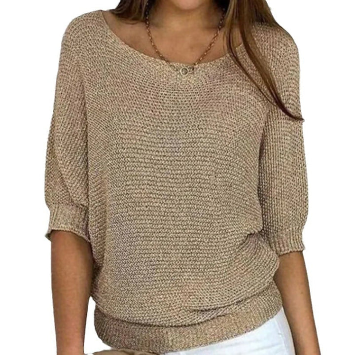 Model wearing the Carla comfort sweater in a relaxed fit, showcasing its soft texture and flattering silhouette