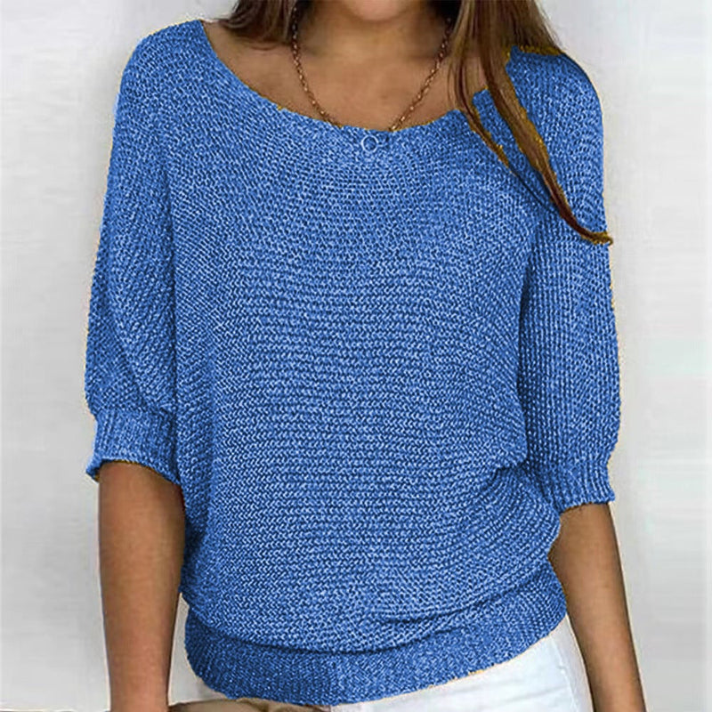 Side profile of model in the Carla comfort sweater demonstrating its elegant, figure-enhancing cut