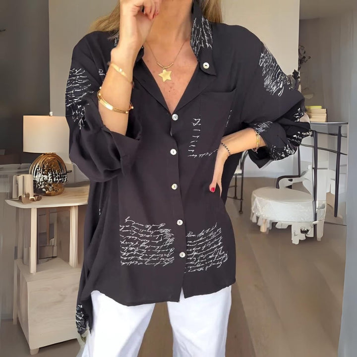 Model wearing the Carla handwritten script button-up shirt in a relaxed fit with button-front closure