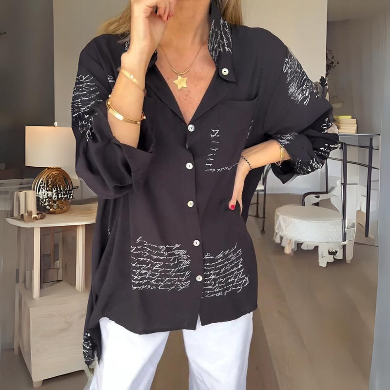 Model wearing the Carla handwritten script button-up shirt in a relaxed fit with button-front closure