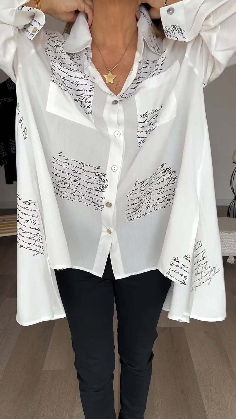 Model styling the Carla shirt tucked into high-waist jeans for a casual daytime look