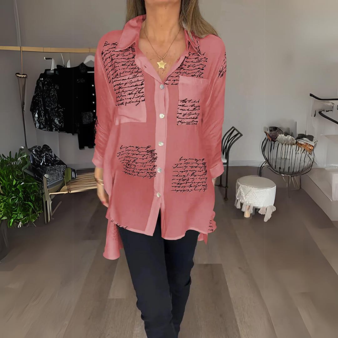Carla button-up shirt laid flat displaying the full script print pattern