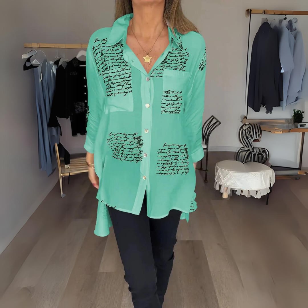 Model wearing the Carla shirt open over a cami for a layered street-style outfit