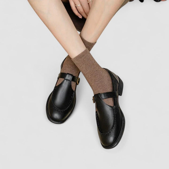 Florimay Carla square-toe Mary Jane shoes in black with T-strap detail, front view on white background