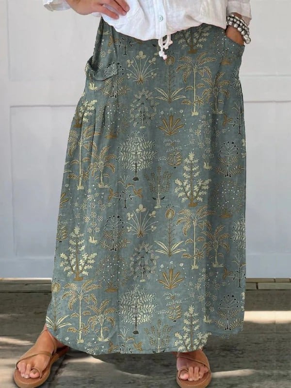Dark green woodland vegetation print A-line skirt with elastic waistband and side pockets, shown in full length