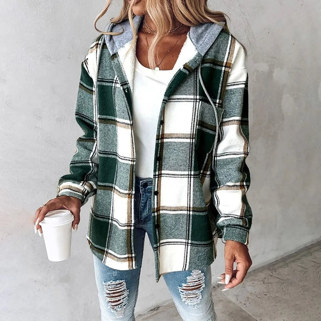 Side profile of woman in checkered cardigan layered over a casual outfit