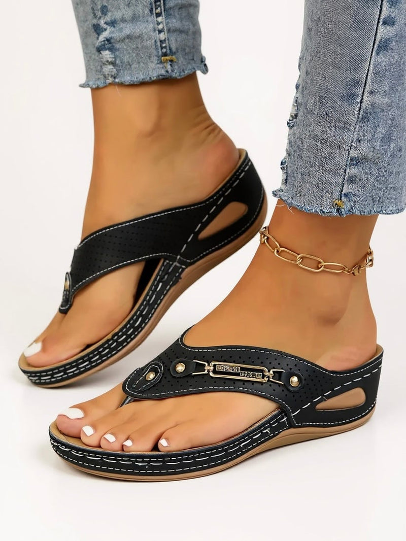 Carmen cushioned slip-on sandals in black, side profile showing lightweight sole