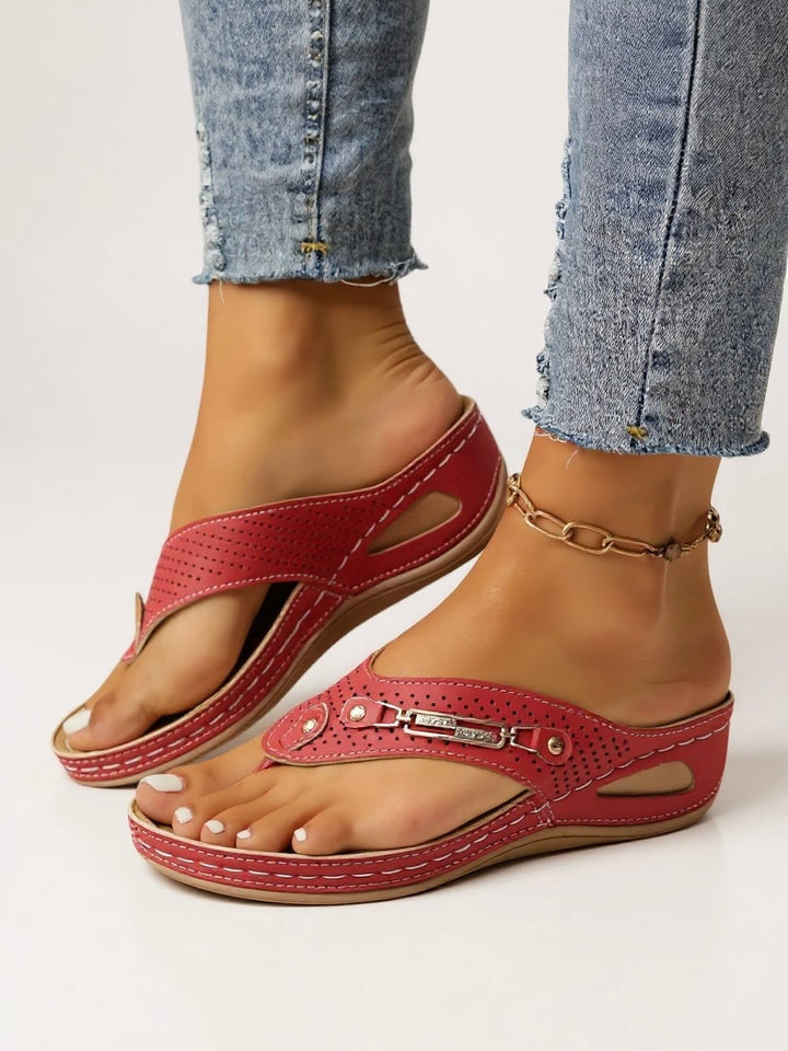 Carmen cushioned slip-on sandals in white on white background, front view
