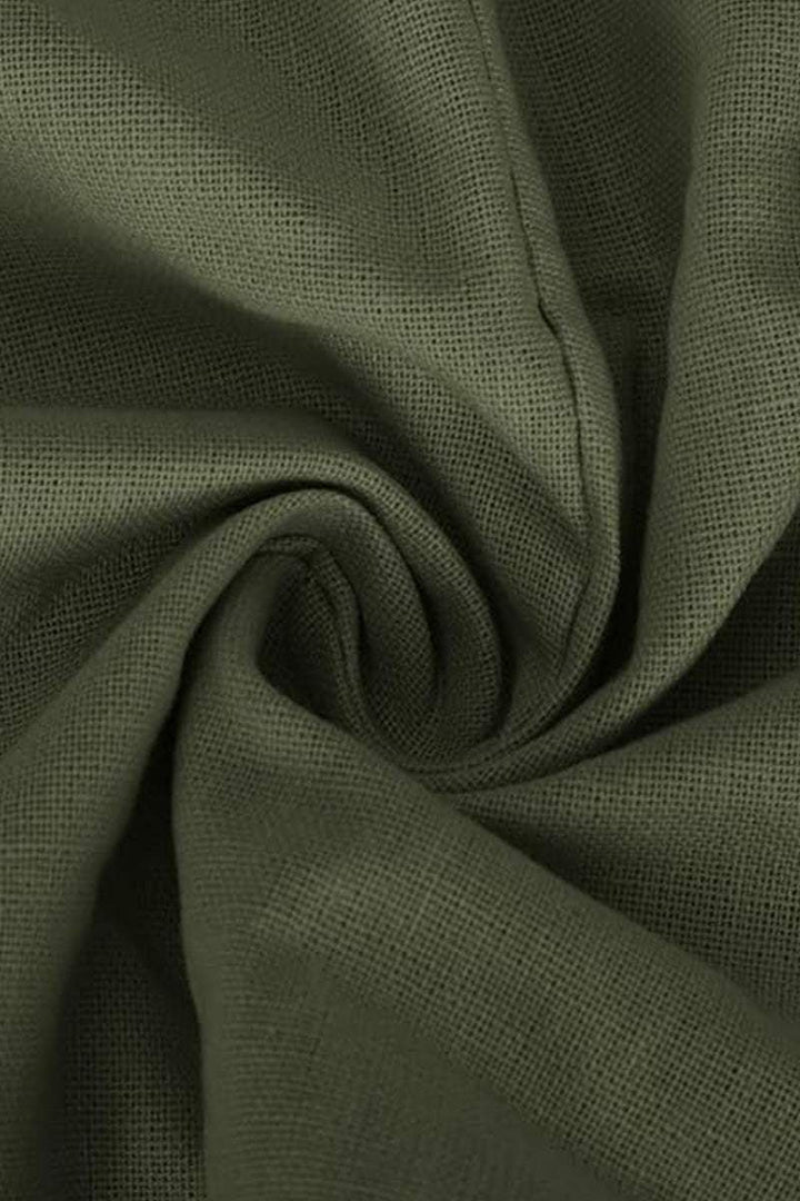 Close-up detail of the Carmen gray V-neckline and draped batwing sleeve