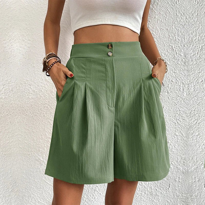 Full-length view of women's stylish shorts paired with sandals
