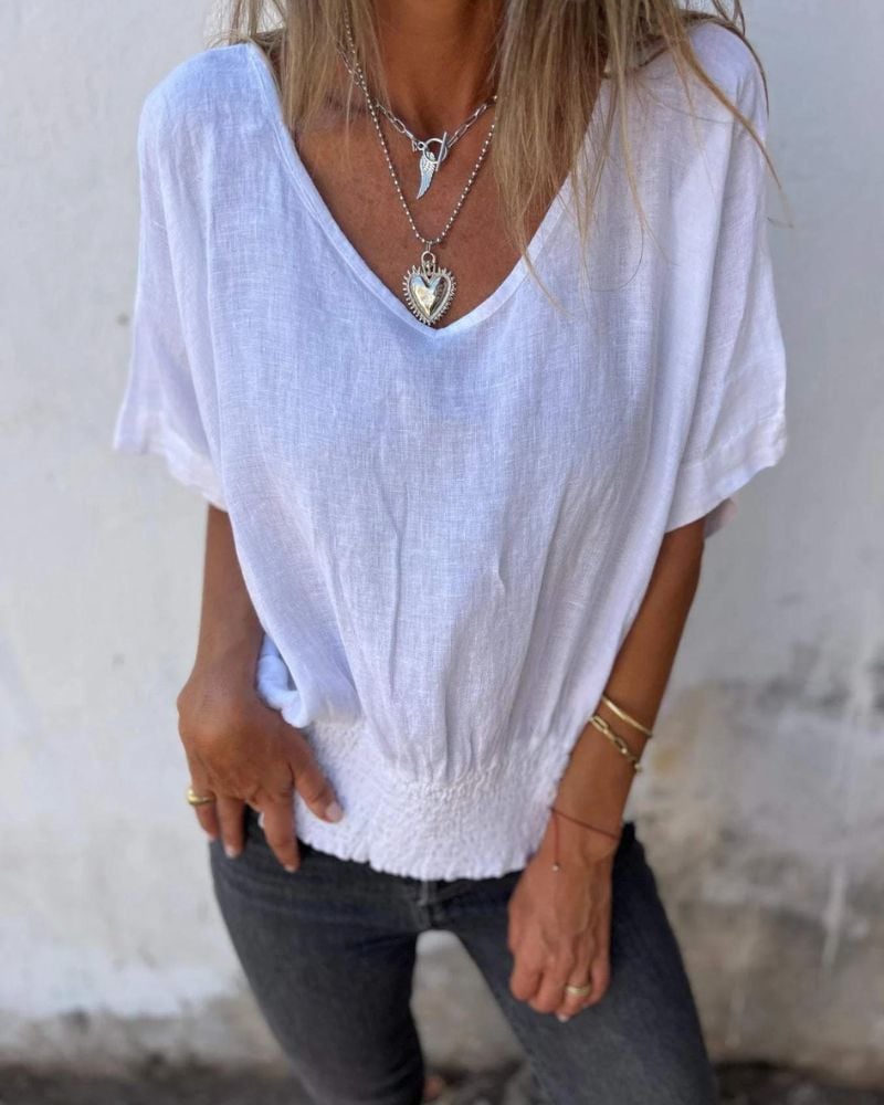 Front view of the Carol relaxed summer top in white showing the breezy silhouette and V-neckline