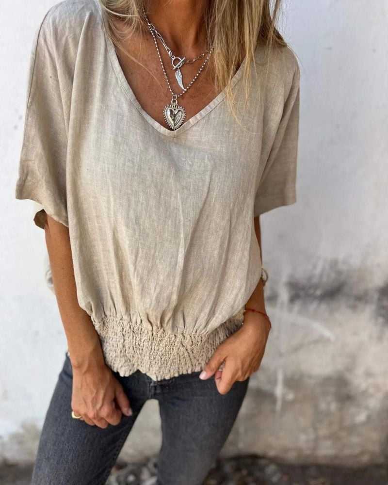 Close-up detail of the V-neckline and lightweight fabric on the Carol relaxed summer top