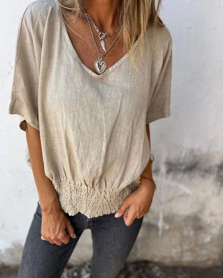 Close-up detail of the V-neckline and lightweight fabric on the Carol relaxed summer top