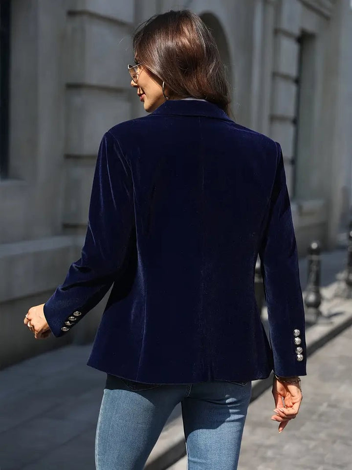 Full-length shot of a model in a black velvet blazer showing length and silhouette