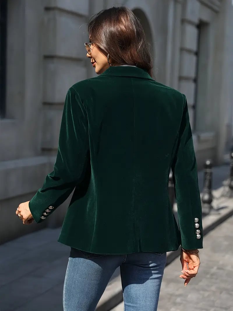 Back view of a red velvet blazer showing clean tailoring and smooth drape