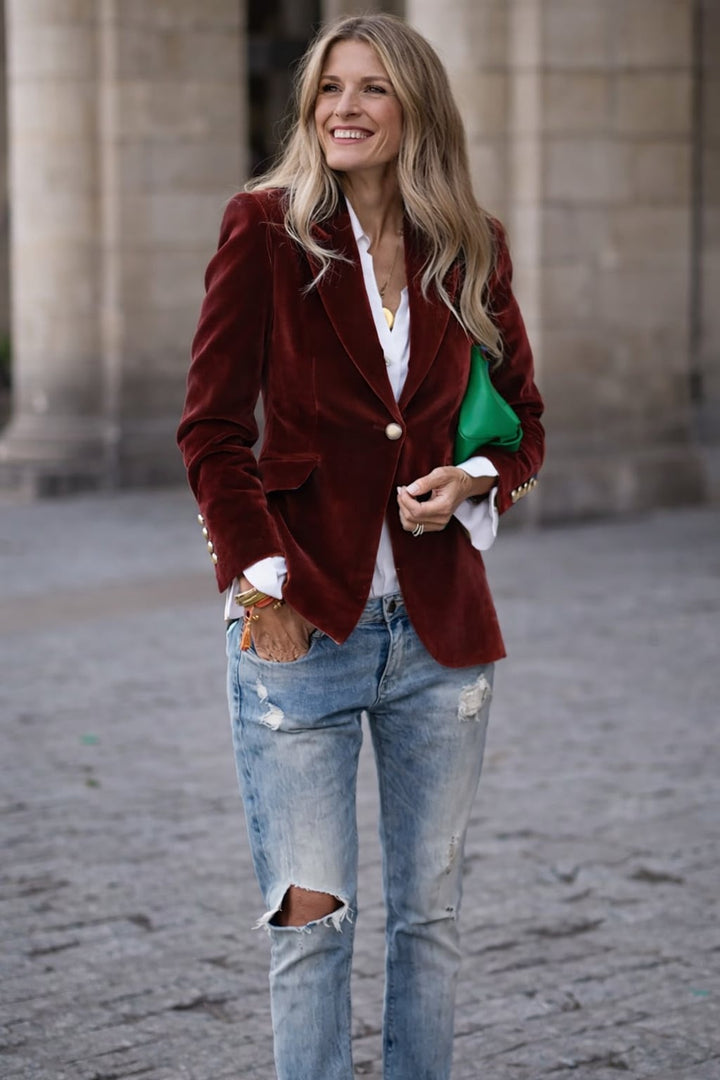 Side-by-side color comparison of black, blue, green, and red velvet blazers