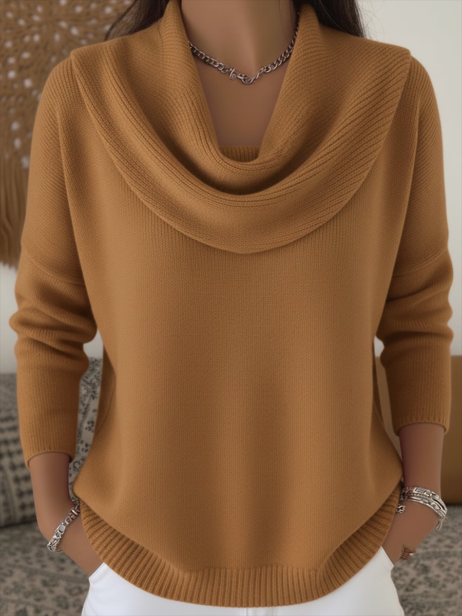 Close-up detail of the draped cowl collar on a cozy knit sweater in brown