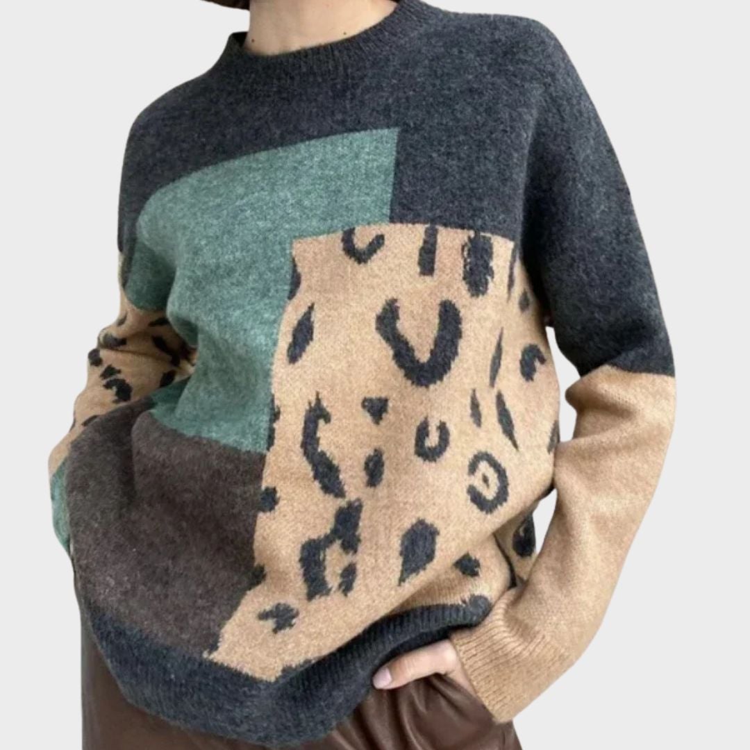 Caroline sweater in gray displayed on a model, perfect for layering or wearing on its own