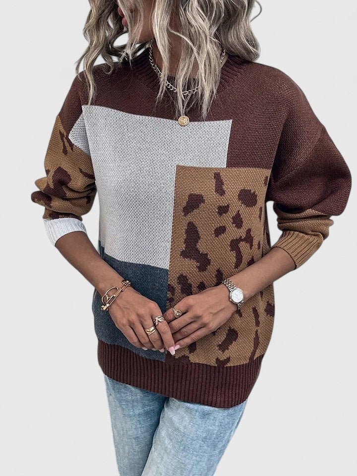 Side view of the Caroline sweater in black showing its smooth drape and relaxed fit
