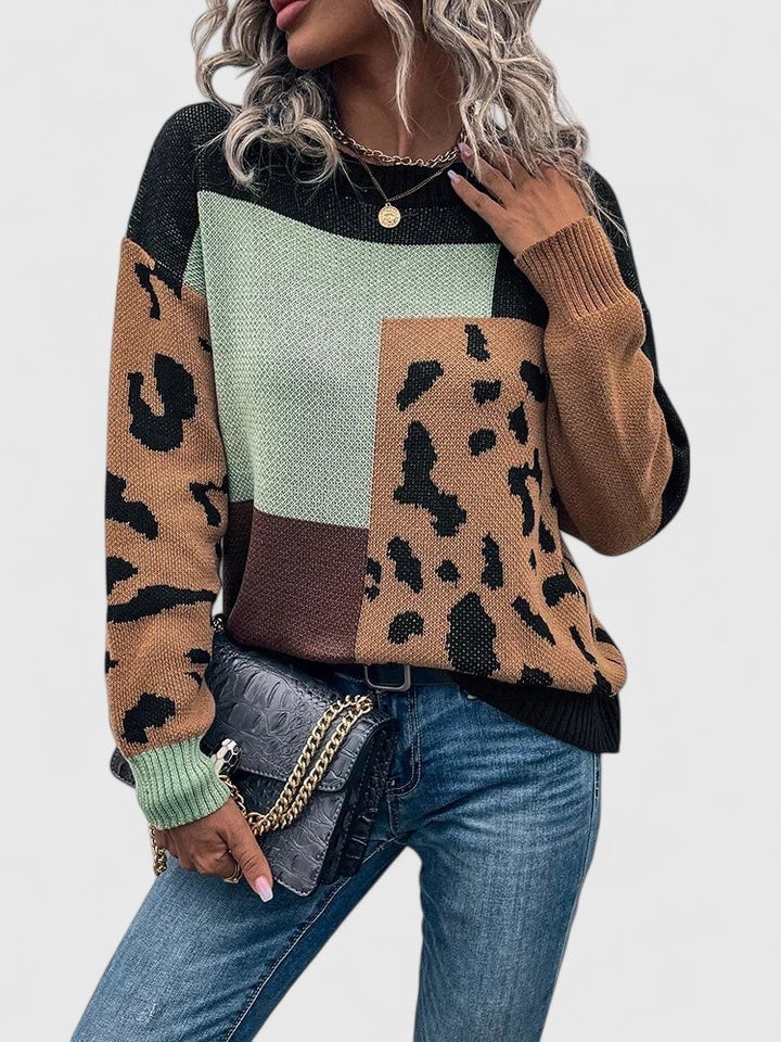 Full-length shot of the Caroline sweater in gray layered over a slip dress for a chic look