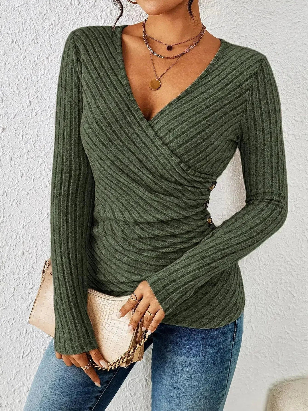 Front view of the tummy-tucking long sleeve top in green showing the V-neckline and shaping silhouette