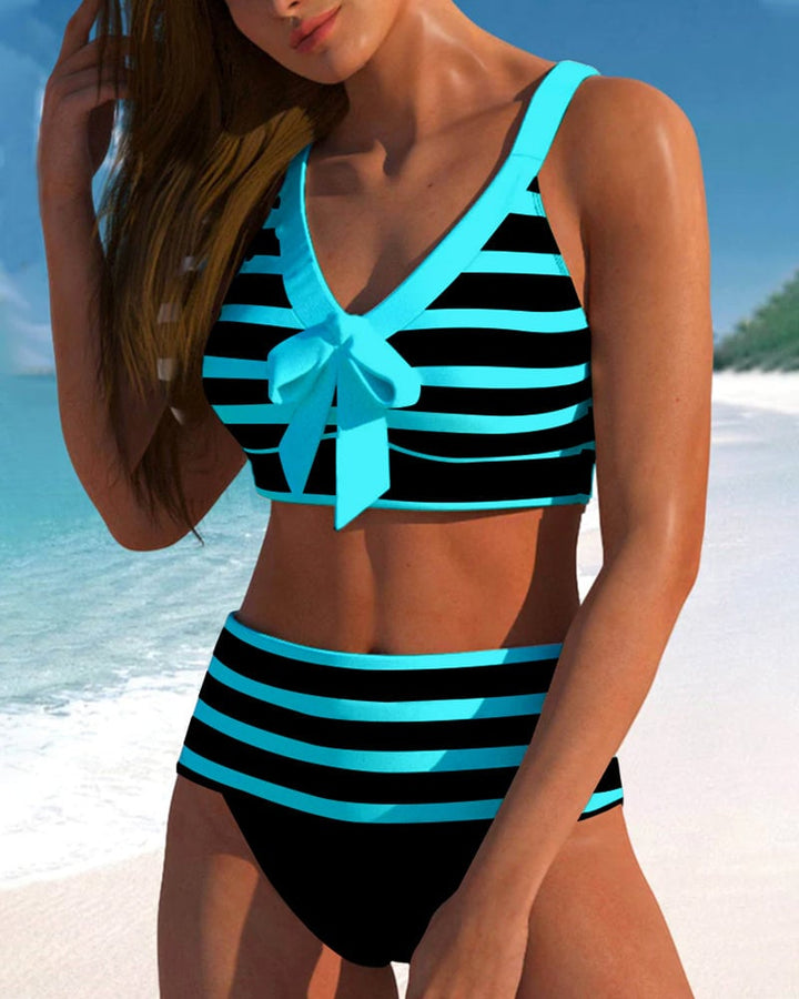 Close-up of blue striped fabric and top detail on Caroline bikini set