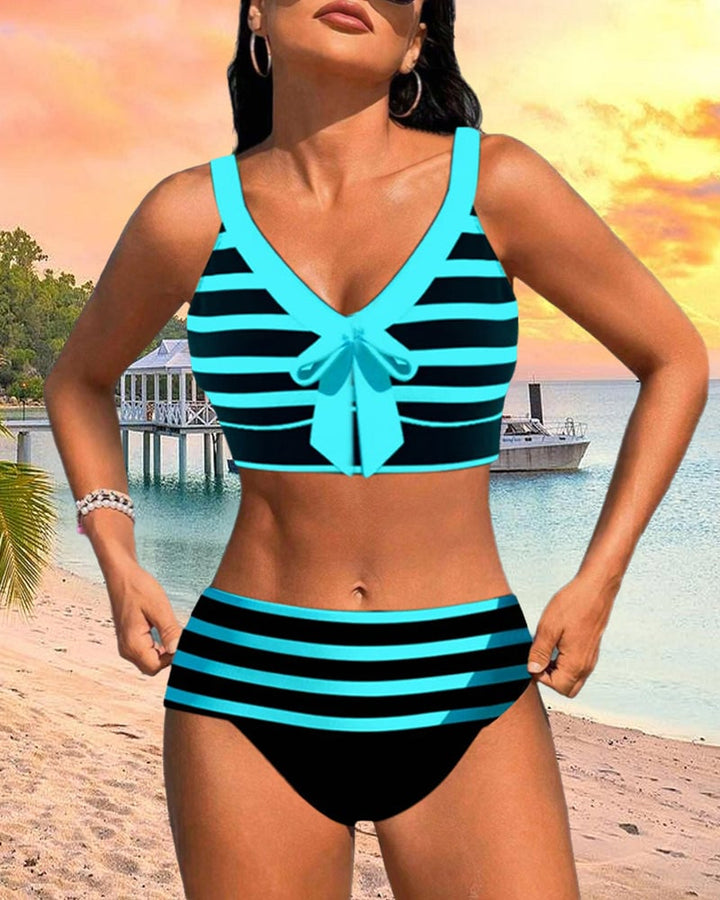 Close-up of pink stripe pattern and high waist bottom on Caroline bikini