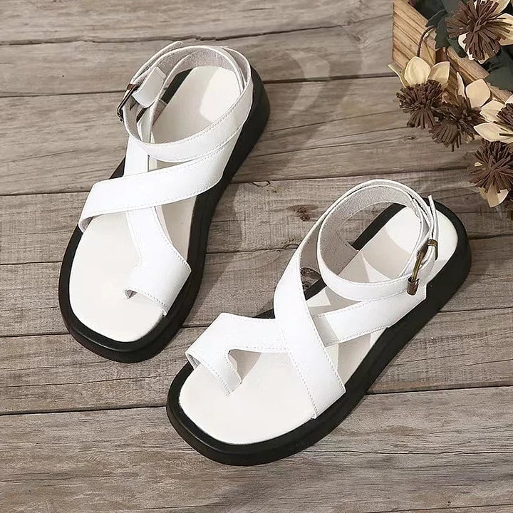 Caroline women's platform buckle sandals in white with criss-cross straps and cushioned sole, front view