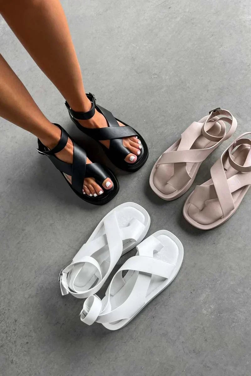 Caroline women's platform buckle sandals in orange styled with a summer outfit, full-length lifestyle shot