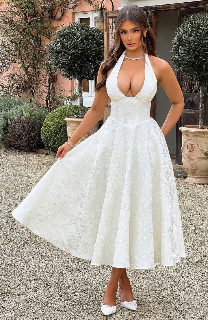 Front view of the Caroline white embroidered V-neck dress showing flowing silhouette