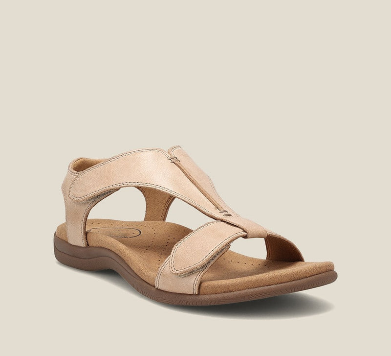 Carolyn sandals in yellow and beige colorways displayed side by side on a neutral surface
