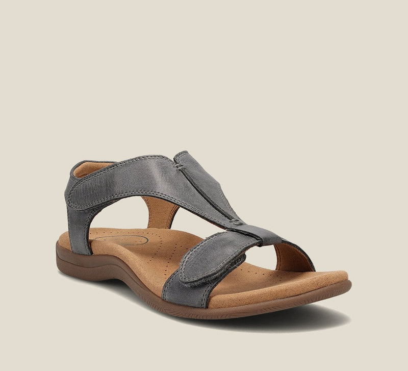 Close-up of Carolyn sandal T-strap buckle detail in black vegan leather