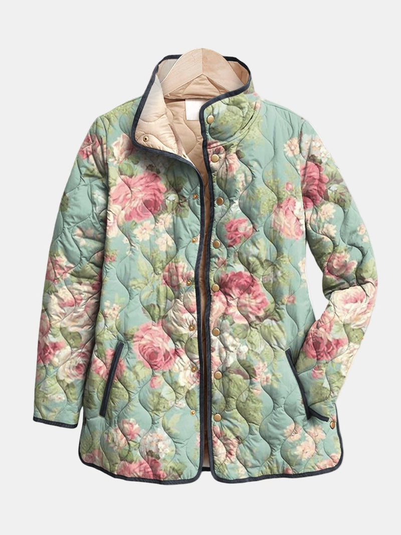Woman wearing a multicolor retro floral quilted jacket with a relaxed fit, styled for a casual everyday look
